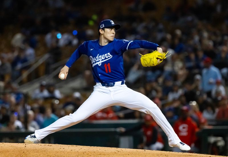 Mar 4, 2025; Phoenix, Arizona, USA; Los Angeles Dodgers pitcher Roki Sasaki against the Cincinnati Reds during a spring training game at Camelback Ranch-Glendale. Mandatory Credit: Mark J. Rebilas-Imagn Images