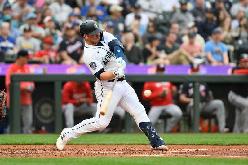 Jun 27, 2023; Seattle, Washington, USA; Seattle Mariners first baseman Ty France (23) hits a single against the Washington Nationals during the fourth inning at T-Mobile Park. Mandatory Credit: Steven Bisig-USA TODAY Sports