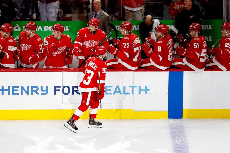 Mar 4, 2026; Detroit, Michigan, USA;  Detroit Red Wings right wing Alex DeBrincat (93) receives congratulations from teammates after scoring in the first period against the Vegas Golden Knights at Little Caesars Arena. Mandatory Credit: Rick Osentoski-Imagn Images