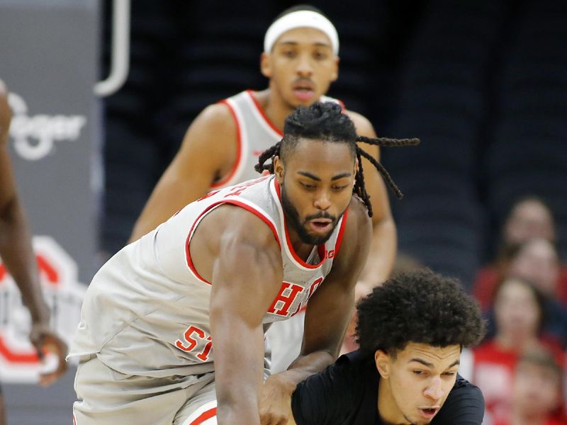 Jan 3, 2024; Columbus, Ohio, USA; Ohio State Buckeyes guard Evan Mahaffey (12) and Rutgers Scarlet Knights guard Derek Simpson (0) go for the loose ball during the first half at Value City Arena. Mandatory Credit: Joseph Maiorana-USA TODAY Sports