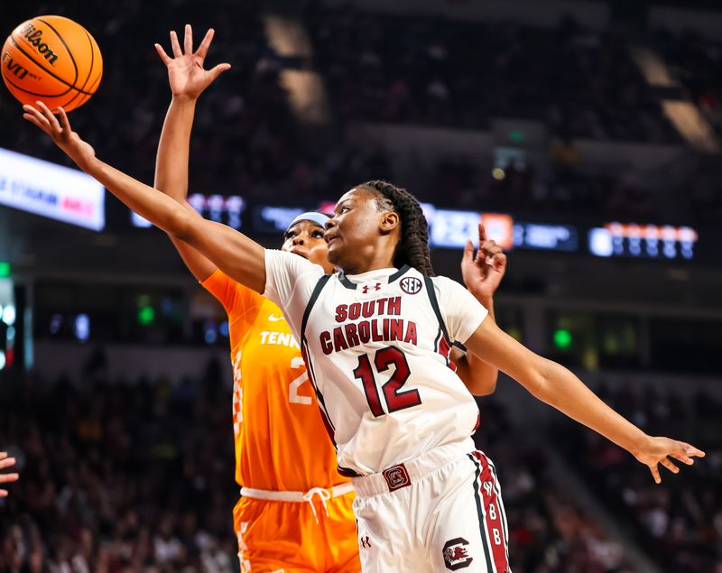Mar 3, 2024; Columbia, South Carolina, USA; South Carolina Gamecocks guard MiLaysia Fulwiley (12) drives past Tennessee Lady Vols center Tamari Key (20) in the first half at Colonial Life Arena. Mandatory Credit: Jeff Blake-USA TODAY Sports