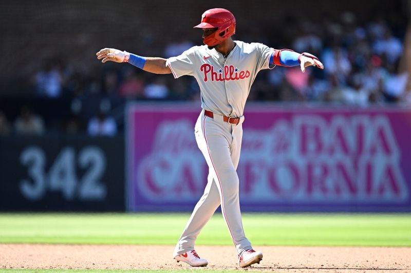 Apr 28, 2024; San Diego, California, USA; Philadelphia Phillies center fielder Johan Rojas (18) celebrates after hitting an RBI double against the San Diego Padres during the eighth inning at Petco Park. Mandatory Credit: Orlando Ramirez-USA TODAY Sports