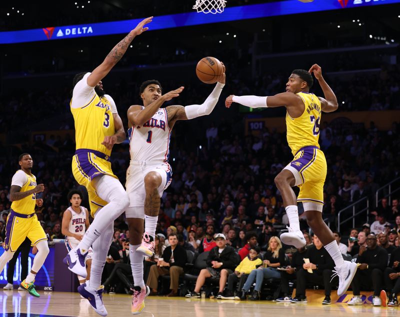 LOS ANGELES, CALIFORNIA - NOVEMBER 08: KJ Martin #1 of the Philadelphia 76ers attempts a layup between Rui Hachimura #28 and Anthony Davis #3 of the Los Angeles Lakers during the first half at Crypto.com Arena on November 08, 2024 in Los Angeles, California. (Photo by Harry How/Getty Images) NOTE TO USER: User expressly acknowledges and agrees that, by downloading and/or using this Photograph, user is consenting to the terms and conditions of the Getty Images License Agreement. (Photo by Harry How/Getty Images)