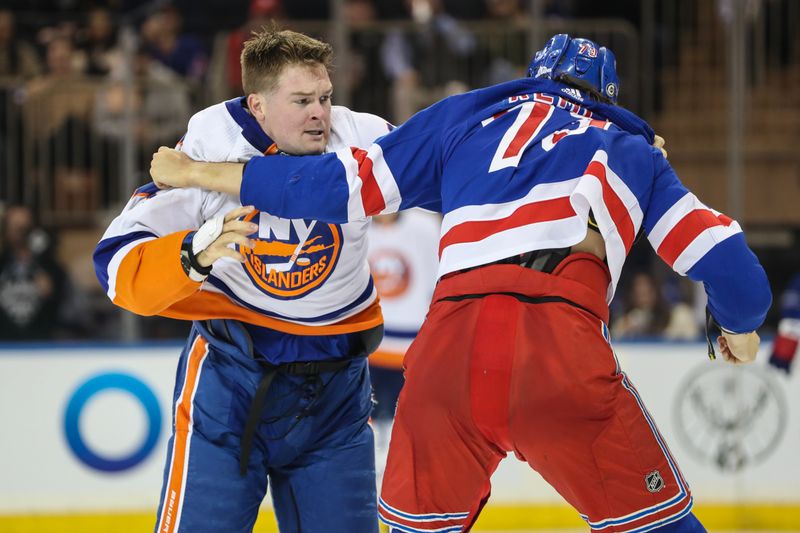 Sep 26, 2023; New York, New York, USA;  New York Rangers center Matt Rempe (73) fights New York Islanders left wing Ross Johnston (32) in the second period at Madison Square Garden. Mandatory Credit: Wendell Cruz-USA TODAY Sports