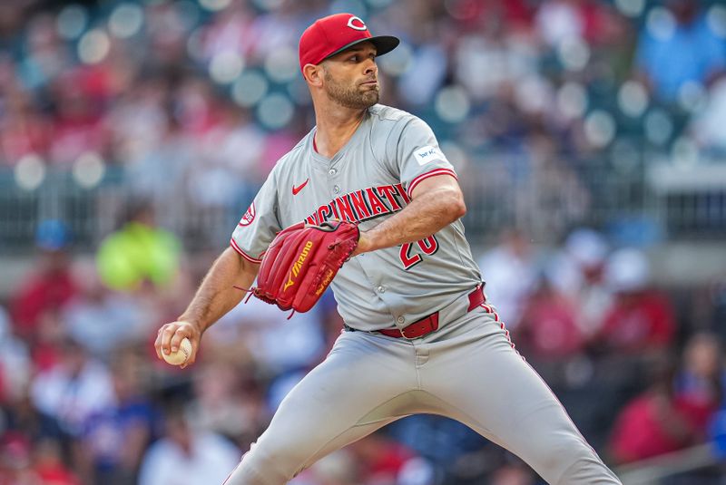 Sep 9, 2024; Cumberland, Georgia, USA; Cincinnati Reds rstarting pitcher Nick Martinez (28) pitches against the Atlanta Braves during the first inning at Truist Park. Mandatory Credit: Dale Zanine-Imagn Images