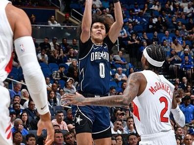 ORLANDO, FL - NOVEMBER 21: Anthony Black #0 of the Orlando Magic shoots the ball during the game against the Toronto Raptors during the In-Season Tournament on November 21, 2023 at Amway Center in Orlando, Florida. NOTE TO USER: User expressly acknowledges and agrees that, by downloading and or using this photograph, User is consenting to the terms and conditions of the Getty Images License Agreement. Mandatory Copyright Notice: Copyright 2023 NBAE (Photo by Fernando Medina/NBAE via Getty Images)