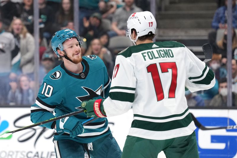 Mar 11, 2023; San Jose, California, USA; San Jose Sharks left wing Evgeny Svechnikov (10) skates against Minnesota Wild left wing Marcus Foligno (17) during the second period at SAP Center at San Jose. Mandatory Credit: Darren Yamashita-USA TODAY Sports