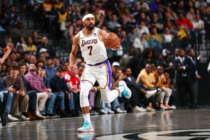 BROOKLYN, NY - MARCH 31: Gabe Vincent #7 of the Los Angeles Lakers handles the ball during the game  on March 31, 2024 at Barclays Center in Brooklyn, New York. NOTE TO USER: User expressly acknowledges and agrees that, by downloading and or using this Photograph, user is consenting to the terms and conditions of the Getty Images License Agreement. Mandatory Copyright Notice: Copyright 2024 NBAE (Photo by David L. Nemec/NBAE via Getty Images)