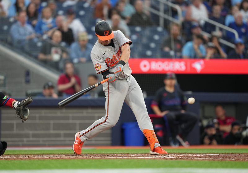 Jun 3, 2024; Toronto, Ontario, CAN; Baltimore Orioles first baseman Ryan Mountcastle (6) gets on first base on a throwing error against the Toronto Blue Jays during the fifth inning at Rogers Centre. Mandatory Credit: Nick Turchiaro-USA TODAY Sports