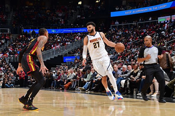 ATLANTA, GA - DECEMBER 11: Jamal Murray #27 of the Denver Nuggets dribbles the ball during the game against the Atlanta Hawks on December 11, 2023 at State Farm Arena in Atlanta, Georgia.  NOTE TO USER: User expressly acknowledges and agrees that, by downloading and/or using this Photograph, user is consenting to the terms and conditions of the Getty Images License Agreement. Mandatory Copyright Notice: Copyright 2023 NBAE (Photo by Scott Cunningham/NBAE via Getty Images)