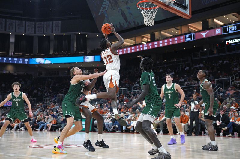 Dec 16, 2025; Austin, Texas, USA; Texas Longhorns guard Tramon Mark (12) drives to the basket against the Le Moyne Dolphins during the second half at Moody Center. Mandatory Credit: Dustin Safranek-Imagn Images