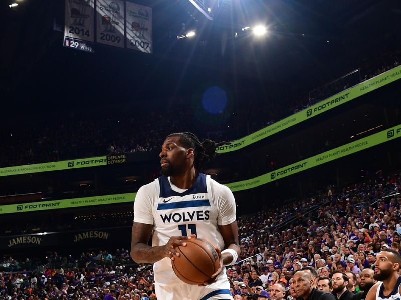 PHOENIX, AZ - APRIL  28: Naz Reid #11 of the Minnesota Timberwolves handles the ball during the game against the Phoenix Suns during Round 1 Game 4 of the 2024 NBA Playoffs on April 28, 2024 at Footprint Center in Phoenix, Arizona. NOTE TO USER: User expressly acknowledges and agrees that, by downloading and or using this photograph, user is consenting to the terms and conditions of the Getty Images License Agreement. Mandatory Copyright Notice: Copyright 2024 NBAE (Photo by Kate Frese/NBAE via Getty Images)