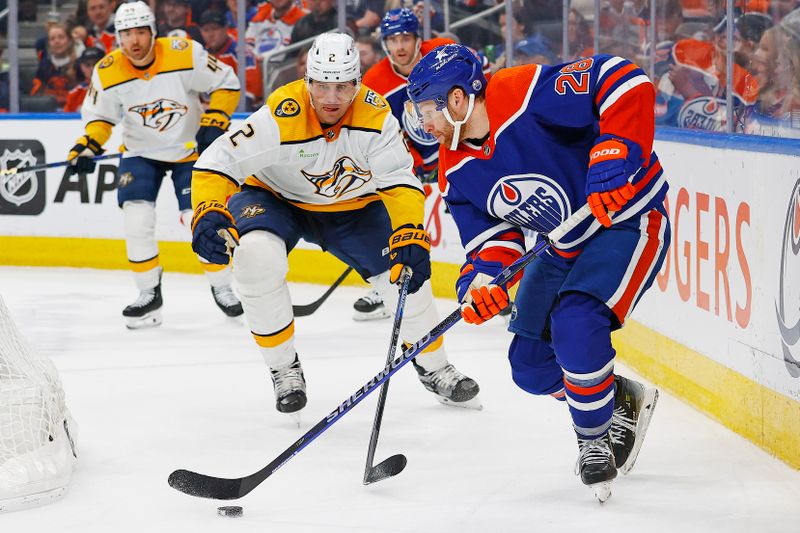 Jan 27, 2024; Edmonton, Alberta, CAN; Edmonton Oilers forward Connor Brown (28) controls the puck in front of Nashville Predators defensemen Luke Schenn (2) during the third period at Rogers Place. Mandatory Credit: Perry Nelson-USA TODAY Sports