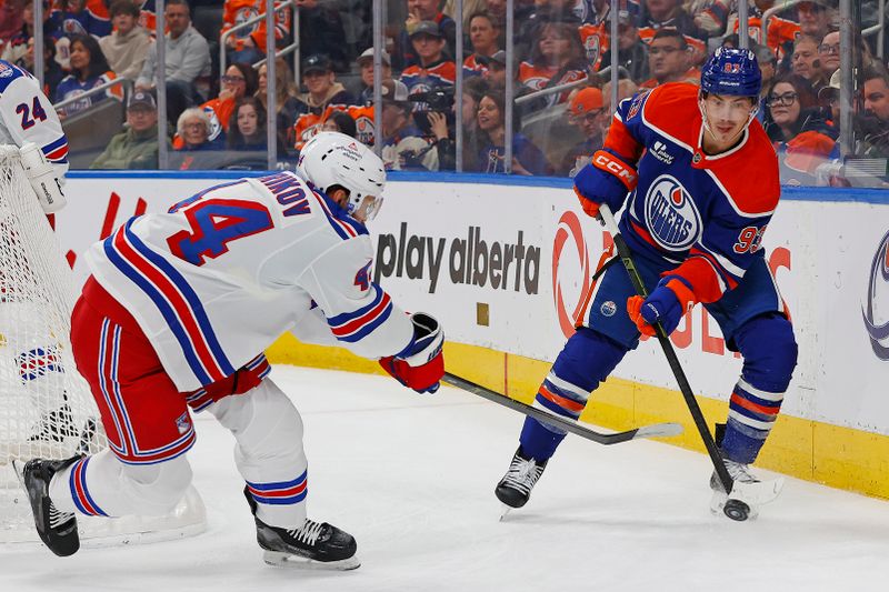 Oct 30, 2025; Edmonton, Alberta, CAN; Edmonton Oilers forward Ryan Nugent-Hopkins (93) makes a pass in front of New York Rangers defensemen Vladislav Gavrikov (44) during the first period at Rogers Place. Mandatory Credit: Perry Nelson-Imagn Images