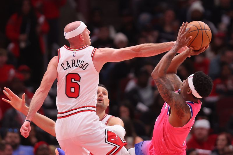 CHICAGO, ILLINOIS - FEBRUARY 26: Bradley Beal #3 of the Washington Wizards shoots over Alex Caruso #6 of the Chicago Bulls during the second half at United Center on February 26, 2023 in Chicago, Illinois. NOTE TO USER: User expressly acknowledges and agrees that, by downloading and or using this photograph, User is consenting to the terms and conditions of the Getty Images License Agreement.  (Photo by Michael Reaves/Getty Images)