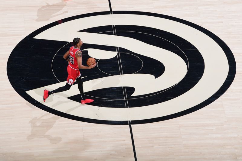 ATLANTA, GA - FEBRUARY 12: Dalen Terry #25 of the Chicago Bulls handles the ball during the game  on February 12, 2024 at State Farm Arena in Atlanta, Georgia.  NOTE TO USER: User expressly acknowledges and agrees that, by downloading and/or using this Photograph, user is consenting to the terms and conditions of the Getty Images License Agreement. Mandatory Copyright Notice: Copyright 2024 NBAE (Photo by Scott Cunningham/NBAE via Getty Images)