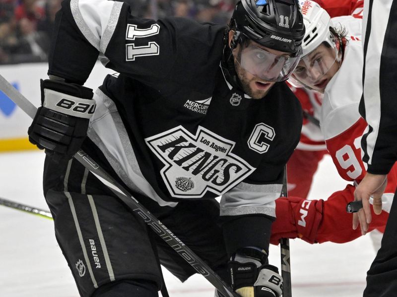 Nov 16, 2024; Los Angeles, California, USA;  Los Angeles Kings center Anze Kopitar (11) gets set for a faceoff against the Detroit Red Wings at Crypto.com Arena. Mandatory Credit: Jayne Kamin-Oncea-Imagn Images