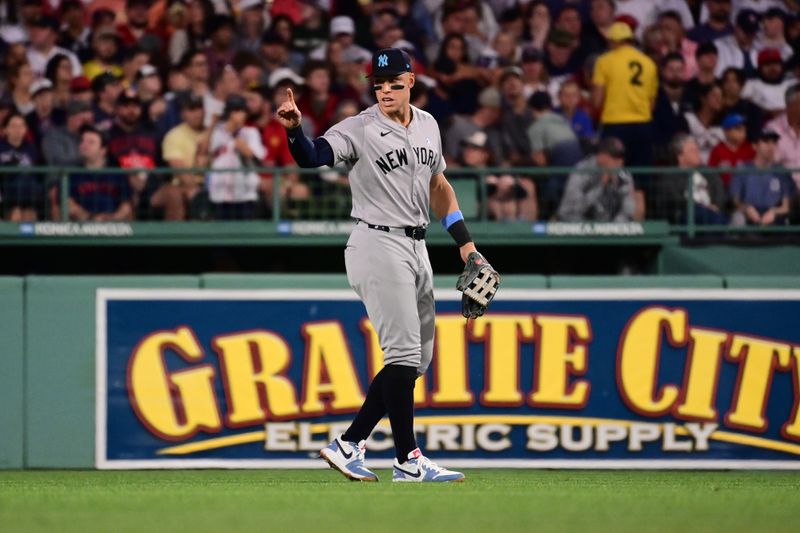 Jun 16, 2024; Boston, Massachusetts, USA; New York Yankees center fielder Aaron Judge (99) signals to teammates during the seventh inning against the Boston Red Sox at Fenway Park. Mandatory Credit: Eric Canha-USA TODAY Sports