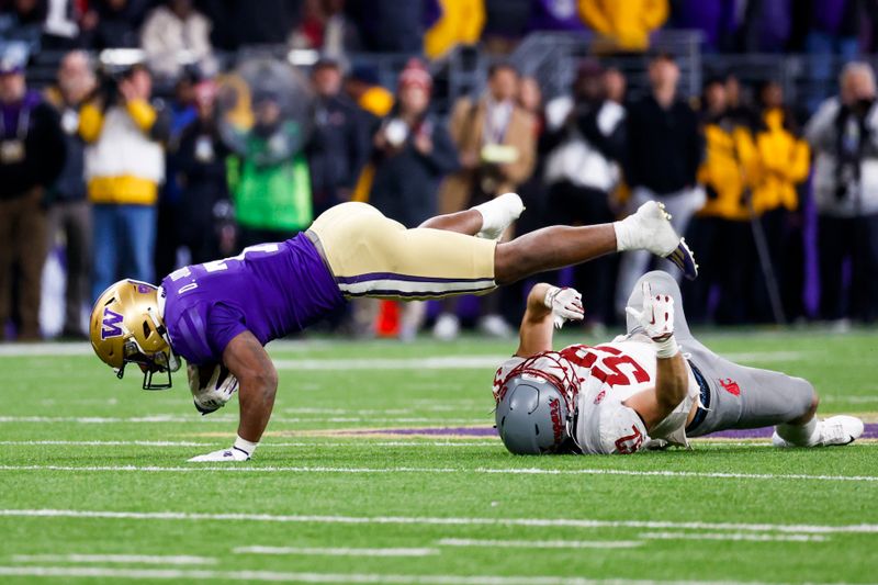 Nov 25, 2023; Seattle, Washington, USA; Washington State Cougars linebacker Kyle Thornton (52) tackles Washington Huskies running back Dillon Johnson (7) during the fourth quarter at Alaska Airlines Field at Husky Stadium. Mandatory Credit: Joe Nicholson-USA TODAY Sports