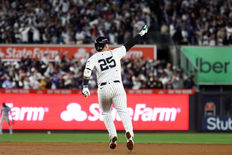 Oct 29, 2024; Bronx, New York, USA;  New York Yankees second baseman Gleyber Torres (25) reacts after hitting a three run home run against the Los Angeles Dodgers in the eighth inning during game four of the 2024 MLB World Series at Yankee Stadium. Mandatory Credit: Vincent Carchietta-Imagn Images