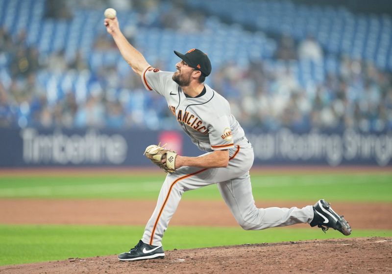 Jun 29, 2023; Toronto, Ontario, CAN; San Francisco Giants starting pitcher Tristan Beck (43) throws a pitch against the Toronto Blue Jays during the eighth inning at Rogers Centre. Mandatory Credit: Nick Turchiaro-USA TODAY Sports