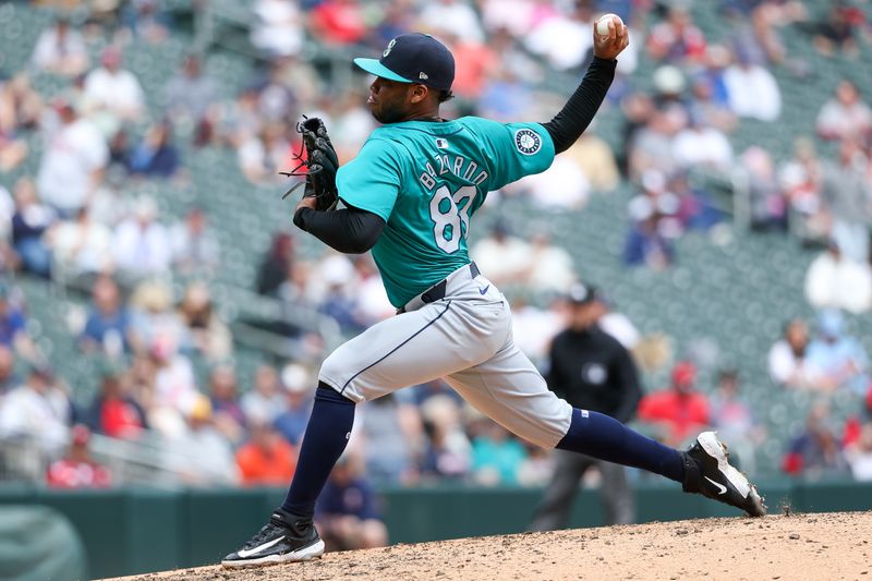 May 9, 2024; Minneapolis, Minnesota, USA; Seattle Mariners relief pitcher Eduard Bazardo (83) delivers a pitch against the Minnesota Twins during the fifth inning at Target Field. Mandatory Credit: Matt Krohn-USA TODAY Sports