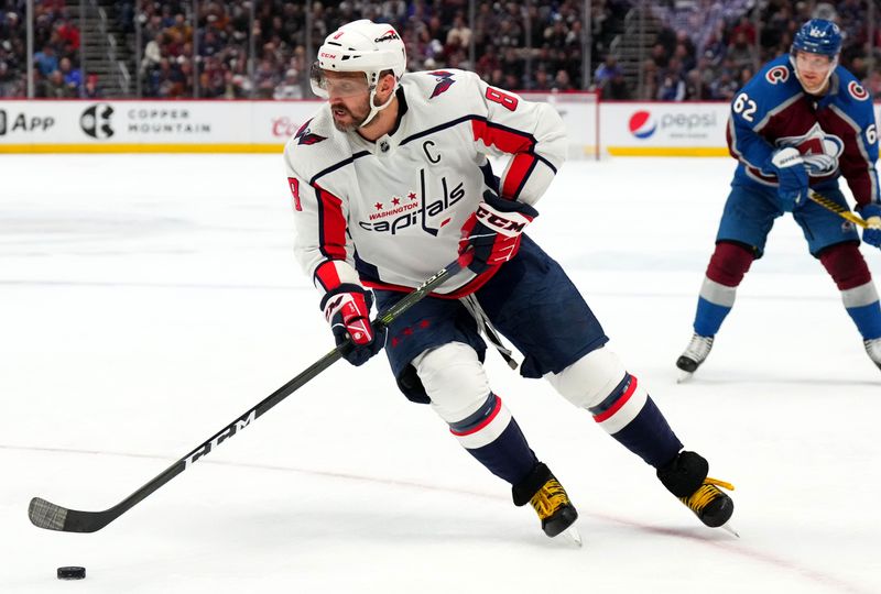 Jan 24, 2023; Denver, Colorado, USA; Washington Capitals left wing Alex Ovechkin (8) controls the puck in the third period against the Colorado Avalanche at Ball Arena. Mandatory Credit: Ron Chenoy-USA TODAY Sports