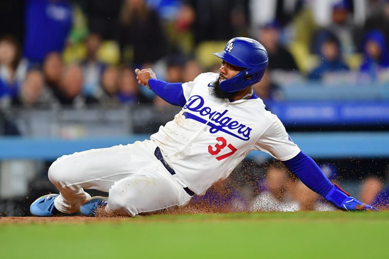 Apr 13, 2024; Los Angeles, California, USA; Los Angeles Dodgers right fielder Teoscar Hernandez (37) scores a run against the San Diego Padres during the seventh inning at Dodger Stadium. Mandatory Credit: Gary A. Vasquez-USA TODAY Sports