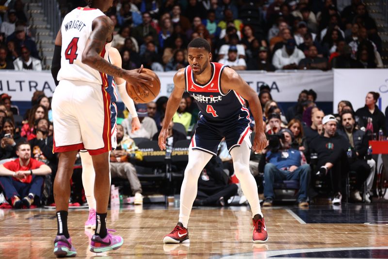 WASHINGTON, DC -? MARCH 31: Jared Butler #4 of the Washington Wizards plays defense against the Miami Heat on March 31, 2024 at Capital One Arena in Washington, DC. NOTE TO USER: User expressly acknowledges and agrees that, by downloading and or using this Photograph, user is consenting to the terms and conditions of the Getty Images License Agreement. Mandatory Copyright Notice: Copyright 2024 NBAE (Photo by Kenny Giarla/NBAE via Getty Images)