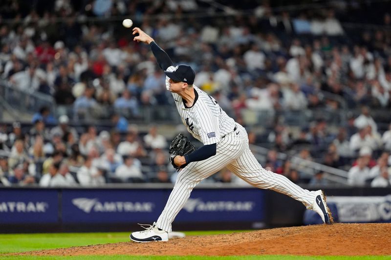 Sep 12, 2024; Bronx, New York, USA; New York Yankees pitcher Clay Holmes (35) delivers a pitch against the Boston Red Sox during the tenth inning at Yankee Stadium. Mandatory Credit: Gregory Fisher-Imagn Images