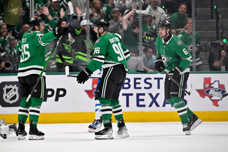 May 11, 2025; Dallas, Texas, USA; Dallas Stars defenseman Thomas Harley (55) and right wing Mikko Rantanen (96) and defenseman Lian Bichsel (6) celebrates Harley scoring a goal against the Winnipeg Jets during the first period in game three of the second round of the 2025 Stanley Cup Playoffs at American Airlines Center. Mandatory Credit: Jerome Miron-Imagn Images