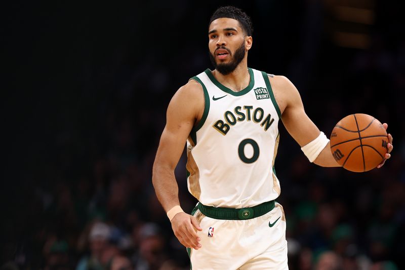 BOSTON, MASSACHUSETTS - MARCH 14: Jayson Tatum #0 of the Boston Celtics dribbles against the Phoenix Suns during the second half at TD Garden on March 14, 2024 in Boston, Massachusetts. The Celtics defeat the Suns 127-112. NOTE TO USER: User expressly acknowledges and agrees that, by downloading and or using this photograph, user is consenting to the terms and conditions of the Getty Images License Agreement.  (Photo by Maddie Meyer/Getty Images)