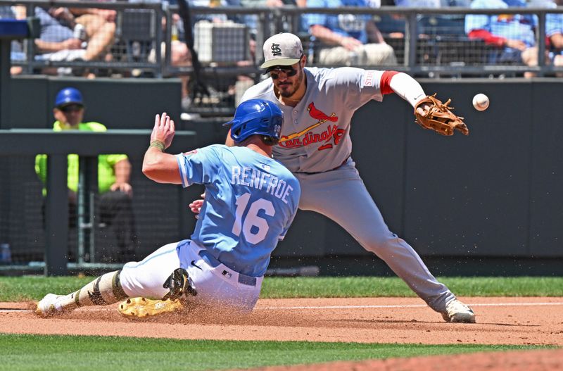May 18, 2025; Kansas City, Missouri, USA;  Kansas City Royals right fielder Hunter Renfroe (16) slides into third bae against St. Louis Cardinals third baseman Nolan Arenado (28) in the fourth inning at Kauffman Stadium. Mandatory Credit: Peter Aiken-Imagn Images