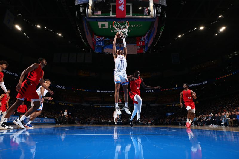 OKLAHOMA CITY, OK - JANUARY 11: Ousmane Dieng #13 of the Oklahoma City Thunder dunks the ball during the game against the Portland Trail Blazers on January 11, 2024 at Paycom Arena in Oklahoma City, Oklahoma. NOTE TO USER: User expressly acknowledges and agrees that, by downloading and or using this photograph, User is consenting to the terms and conditions of the Getty Images License Agreement. Mandatory Copyright Notice: Copyright 2024 NBAE (Photo by Zach Beeker/NBAE via Getty Images)