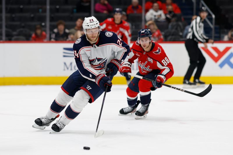 Sep 27, 2024; Washington, District of Columbia, USA; Columbus Blue Jackets right wing Mathieu Olivier (24) skates with the puck as Washington Capitals left wing Andrew Mangiapane (88) chases in the third period at Capital One Arena. Mandatory Credit: Geoff Burke-Imagn Images