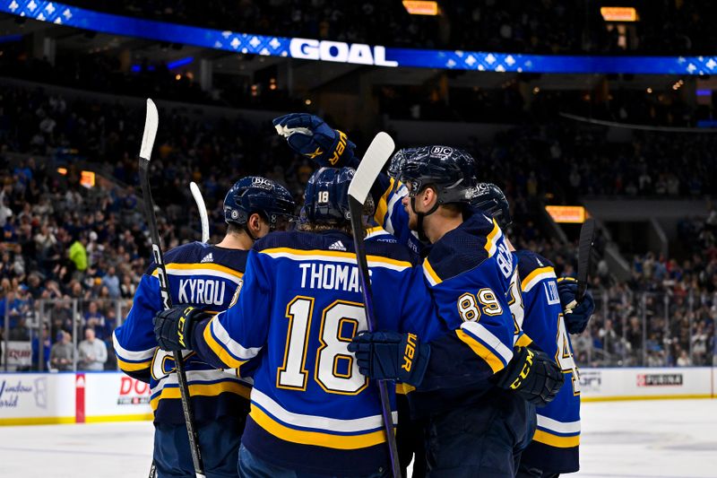 Feb 22, 2024; St. Louis, Missouri, USA;  St. Louis Blues left wing Pavel Buchnevich (89) is congratulated by teammates after scoring against the New York Islanders during the second period at Enterprise Center. Mandatory Credit: Jeff Curry-USA TODAY Sports
