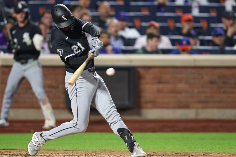 May 27, 2025; New York City, New York, USA; Chicago White Sox right fielder Michael A. Taylor (21) singles during the seventh inning against the New York Mets at Citi Field. Mandatory Credit: Vincent Carchietta-Imagn Images