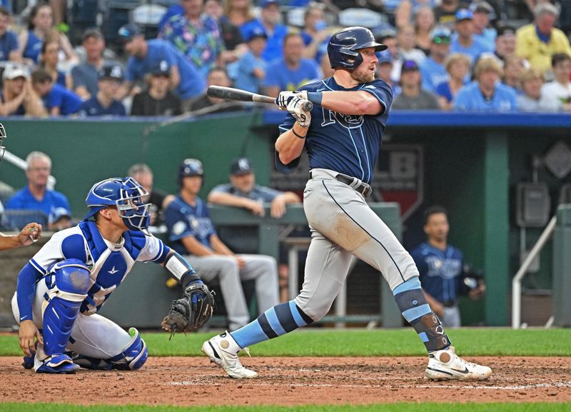 Jul 15, 2023; Kansas City, Missouri, USA;  Tampa Bay Rays first baseman Luke Raley (55) singles in a run against the Kansas City Royals in the eighth inning at Kauffman Stadium. Mandatory Credit: Peter Aiken-USA TODAY Sports