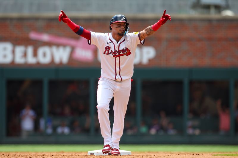 Jul 7, 2024; Atlanta, Georgia, USA; Atlanta Braves shortstop Orlando Arcia (11) reacts after a home run by center fielder Jarred Kelenic (not pictured) against the Philadelphia Phillies in the second inning at Truist Park. Mandatory Credit: Brett Davis-USA TODAY Sports
