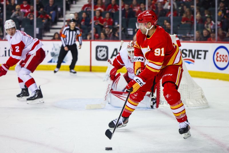 Feb 17, 2024; Calgary, Alberta, CAN; Calgary Flames center Nazem Kadri (91) controls the puck against the Detroit Red Wings during the third period at Scotiabank Saddledome. Mandatory Credit: Sergei Belski-USA TODAY Sports