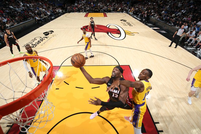 MIAMI, FL - DECEMBER 4: Bam Adebayo #13 of the Miami Heat drives to the basket during the game against the Los Angeles Lakers on December 4, 2024 at Kaseya Center in Miami, Florida. NOTE TO USER: User expressly acknowledges and agrees that, by downloading and or using this Photograph, user is consenting to the terms and conditions of the Getty Images License Agreement. Mandatory Copyright Notice: Copyright 2024 NBAE (Photo by Joe Murphy/NBAE via Getty Images)