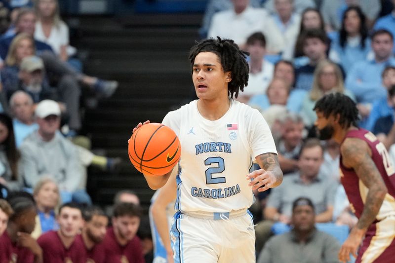 Dec 2, 2023; Chapel Hill, North Carolina, USA;  North Carolina Tar Heels guard Elliot Cadeau (2) with the ball in the first half at Dean E. Smith Center. Mandatory Credit: Bob Donnan-USA TODAY Sports