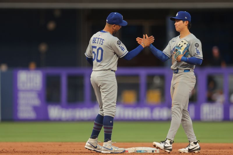 May 5, 2025; Miami, Florida, USA; Los Angeles Dodgers shortstop Mookie Betts (50) celebrates with second baseman Hyeseong Kim (6) after the game against the Miami Marlins at loanDepot Park. Mandatory Credit: Sam Navarro-Imagn Images