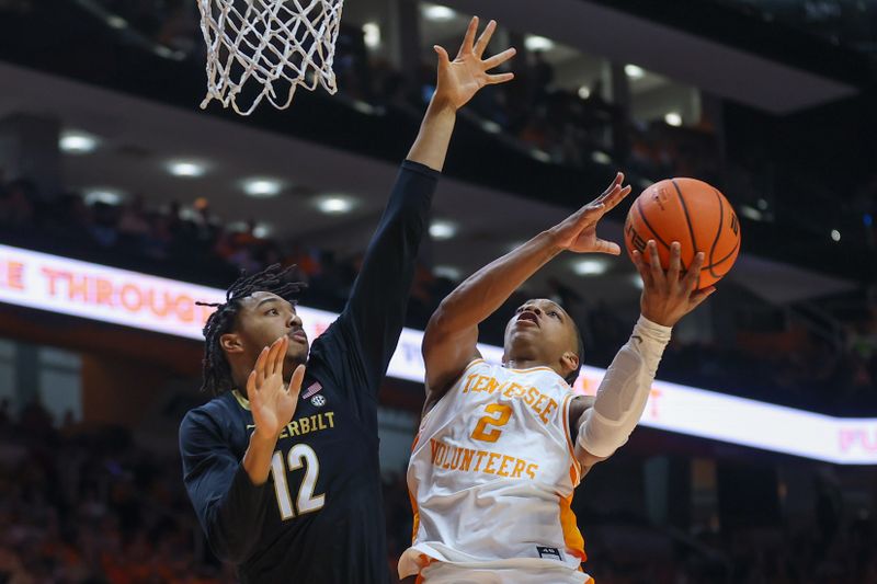 Feb 17, 2024; Knoxville, Tennessee, USA; Tennessee Volunteers guard Jordan Gainey (2) goes to the basket against Vanderbilt Commodores guard Evan Taylor (12) during the second half at Thompson-Boling Arena at Food City Center. Mandatory Credit: Randy Sartin-USA TODAY Sports