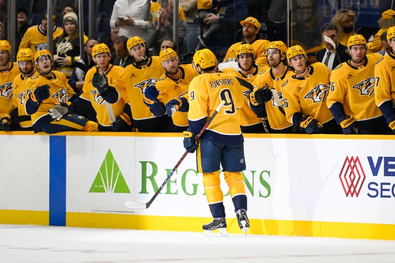 Oct 17, 2024; Nashville, Tennessee, USA;  Nashville Predators left wing Filip Forsberg (9) celebrates his goal with his teammates against the Edmonton Oilers during the first period at Bridgestone Arena. Mandatory Credit: Steve Roberts-Imagn Images