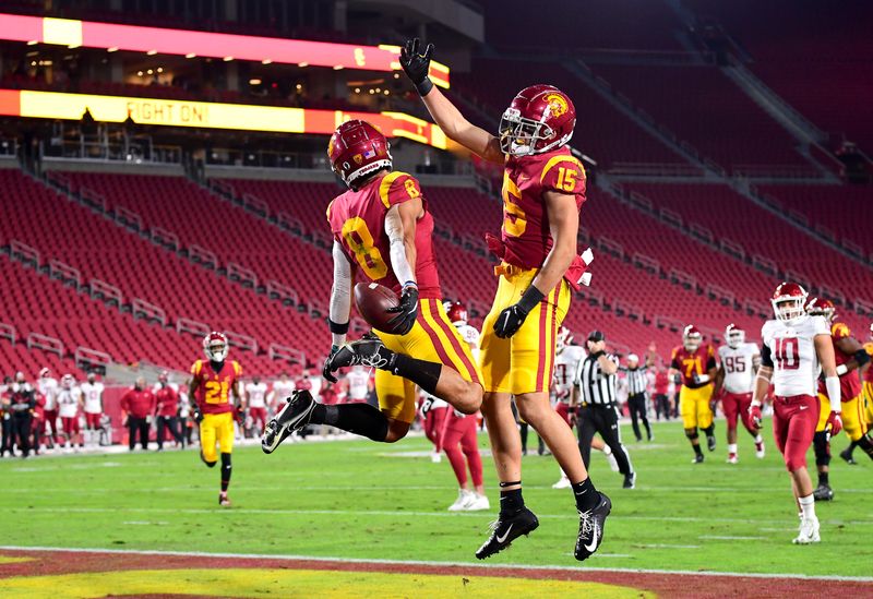 Dec 6, 2020; Los Angeles, California, USA;  USC Trojans wide receiver Amon-Ra St. Brown (8) celebrates with wide receiver Drake London (15) after scoring a touch down in the first quarter of the game Washington State Cougars at United Airlines Field at the Los Angeles Memorial Coliseum. Mandatory Credit: Jayne Kamin-Oncea-USA TODAY Sports