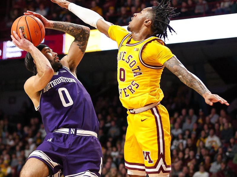 Feb 3, 2024; Minneapolis, Minnesota, USA; Northwestern Wildcats guard Boo Buie (0) shoots as Minnesota Golden Gophers guard Elijah Hawkins (0) defends during the second half at Williams Arena. Mandatory Credit: Matt Krohn-USA TODAY Sports