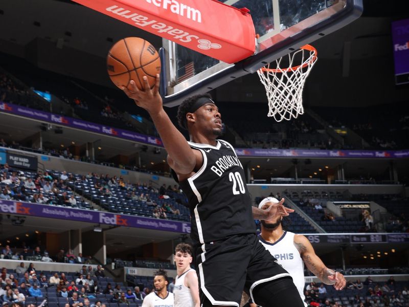 MEMPHIS, TN - February 26:  Day'Ron Sharpe #20 of the Brooklyn Nets looks to pass the ball during the game against the Memphis Grizzlies on February 26, 2024 at FedExForum in Memphis, Tennessee. NOTE TO USER: User expressly acknowledges and agrees that, by downloading and or using this photograph, User is consenting to the terms and conditions of the Getty Images License Agreement. Mandatory Copyright Notice: Copyright 2024 NBAE (Photo by Joe Murphy/NBAE via Getty Images)