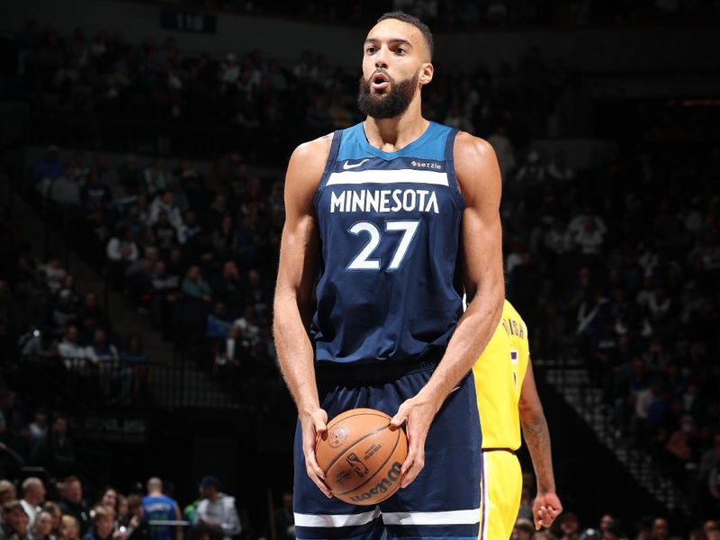 MINNEAPOLIS, MN -  DECEMBER 13:  Rudy Gobert #27 of the Minnesota Timberwolves shoots a free throw during the gameq against the Los Angeles Lakers on December 13, 2024 at Target Center in Minneapolis, Minnesota. NOTE TO USER: User expressly acknowledges and agrees that, by downloading and or using this Photograph, user is consenting to the terms and conditions of the Getty Images License Agreement. Mandatory Copyright Notice: Copyright 2024 NBAE (Photo by David Sherman/NBAE via Getty Images)