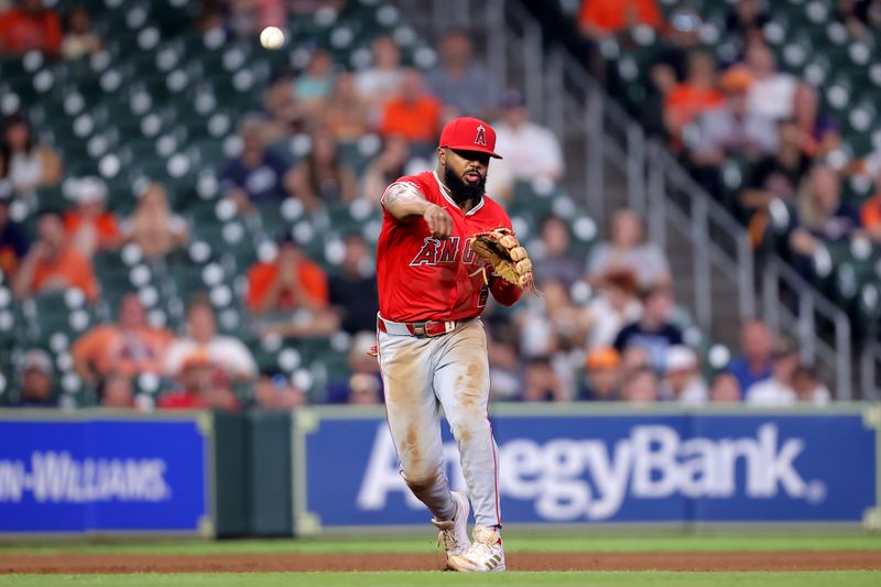 May 20, 2024; Houston, Texas, USA; Los Angeles Angels third baseman Luis Rengifo (2) throws a fielded ball to first base for an out against the Houston Astros during the eighth inning at Minute Maid Park. Mandatory Credit: Erik Williams-USA TODAY Sports